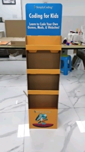 a cardboard display case with a blue and yellow label